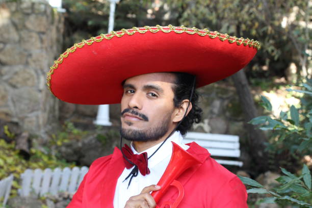 istock Handsome mariachi with red outfit 1287288292