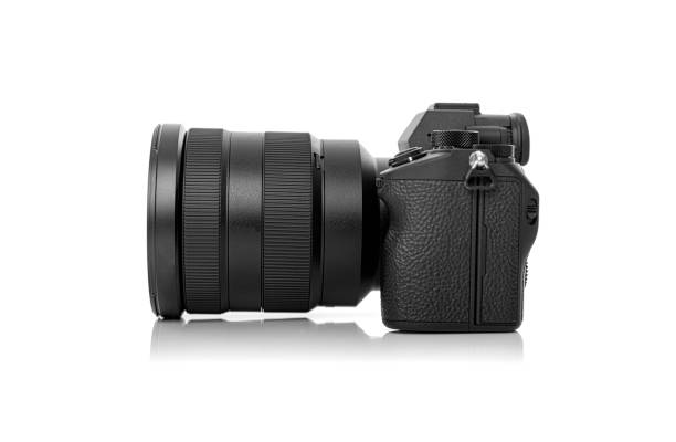 istock Black photo camera isolated on white background 1287289635