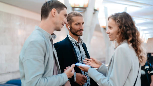 istock young business people discussing ideas at subway station 1287289639