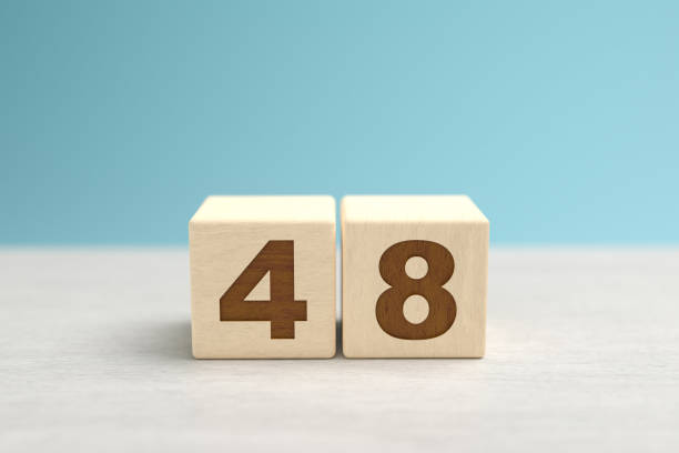 istock Wooden toy blocks forming the number 48. 1287289990