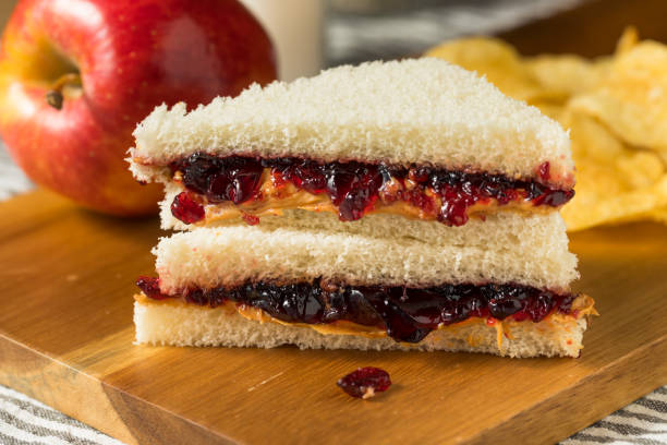 Homemade Crustless Peanut Butter and Jelly Sandwich Homemade Crustless Peanut Butter and Jelly Sandwich with Chips peanut butter and jelly sandwich stock pictures, royalty-free photos & images