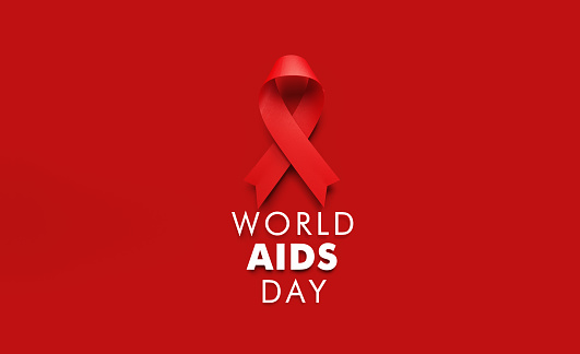 Red AIDS awareness ribbon sitting above World AIDS Day message on red background. Horizontal composition with copy space. World AIDS Day concept.