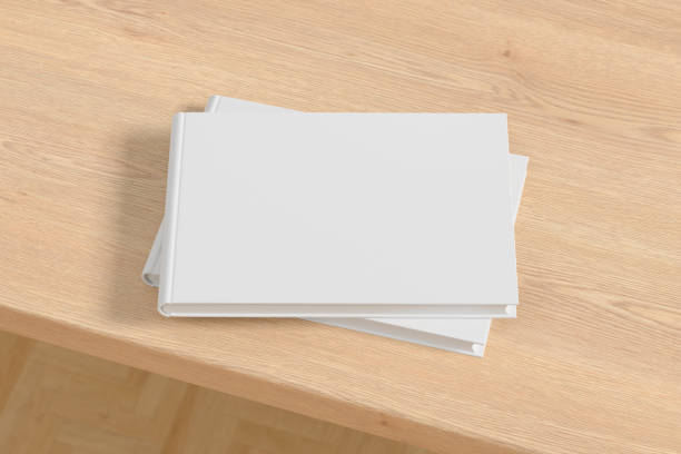 istock Horizontal or landscape white hardcover book stack mockup on the wooden table. 1287292242