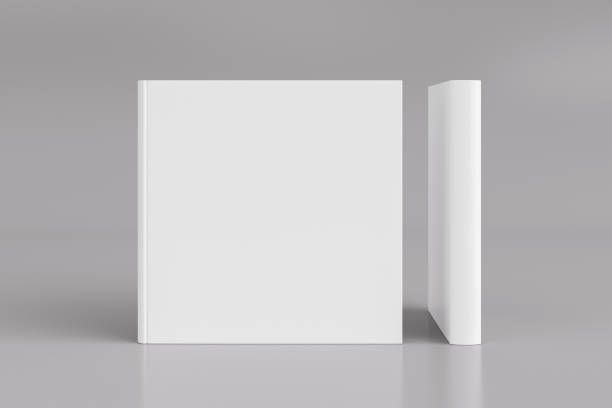istock Two hardcover  square white mockup books standing on the white background. Blank front cover and spine of book. 1287292547