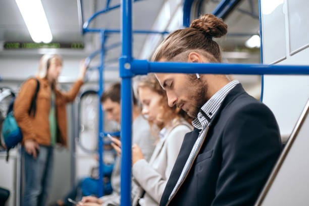 istock tired business man sleeps in a subway train car 1287292791