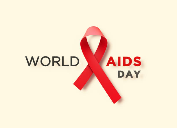 istock Red AIDS Awareness Ribbon Sitting Between World AIDS Day Message on Beige Background 1287292840