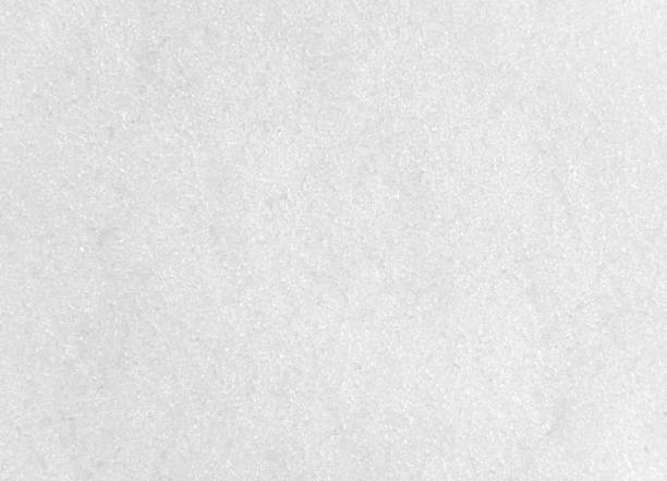istock Abstract texture of pure white snow. 1287293375