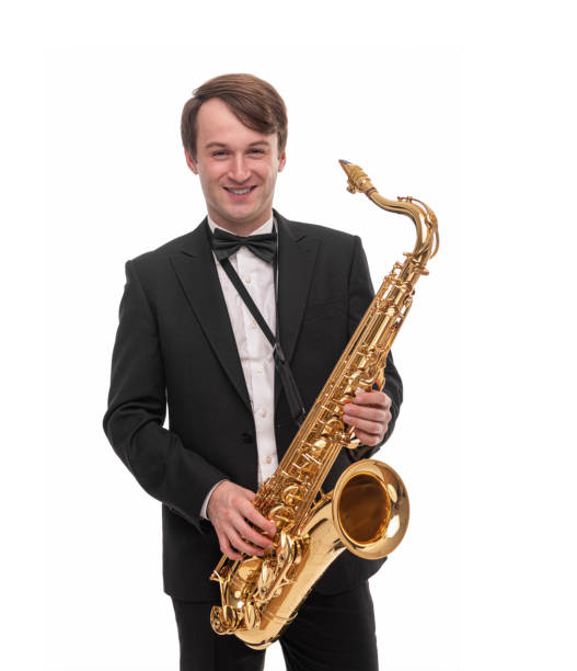istock Saxophonist with a saxophone in his hands on a white. 1287293938
