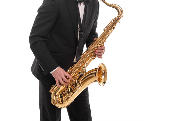 istock Saxophonist with a saxophone in his hands on a white. 1287293946