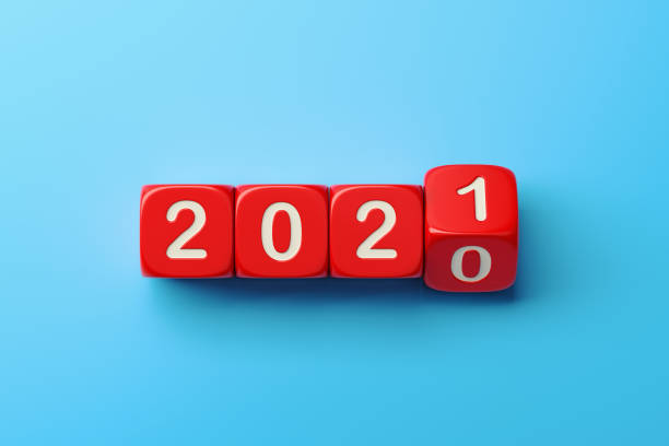 istock Red Dices are Rolling From 2020 to 2021 Over Blue Background 1287294307