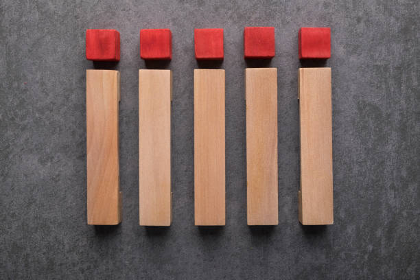 Wooden Blocks On Stone Background In A Row.blank wood cubes mock up on isolated on Gray granite stone background for create letter or symbol, business, banner, advertising concept, banner size with copy space