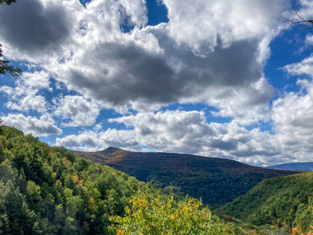 Dramatic sky over mountains in autumn. stock photo