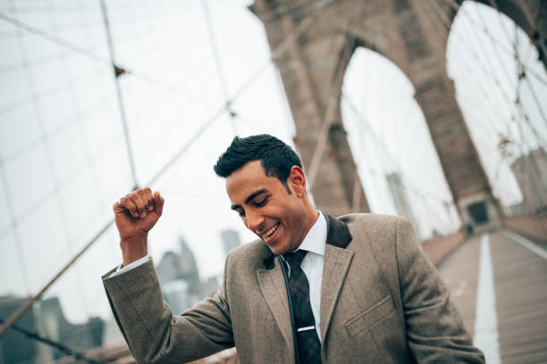 istock winning businessman on brooklyn bridge 1287296216
