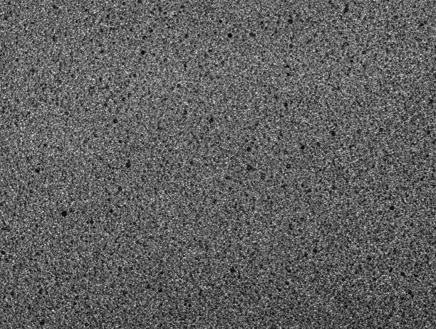 istock Texture of black foam rubber close-up. 1287297441
