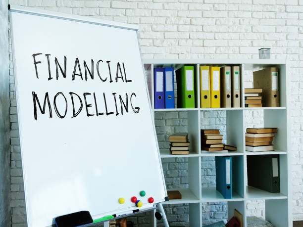 istock Financial modelling words on the whiteboard in the room. 1287299007