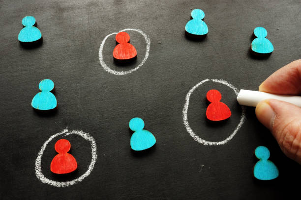 istock Marketing targeting and customer selection concept. The hand is tracing the figures. 1287299063