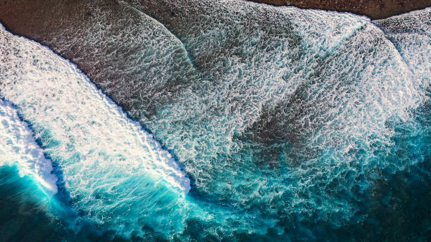Drone view of the ocean waves Drone view of the ocean waves slow motion stock pictures, royalty-free photos & images