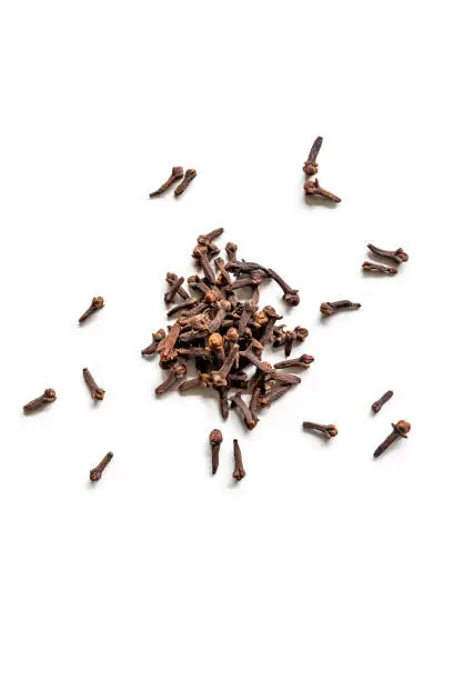 top view of a pile of organic cloves isolated on a white background
