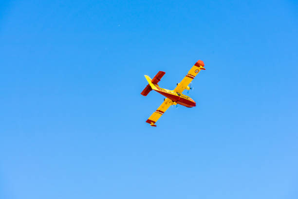 istock yellow fire-fighting plane in the blue sky 1287305461