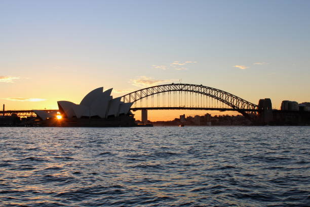 View at sunset from Mrs Macquarie's Chair to the Harbour Bridge and Opera House stock photo