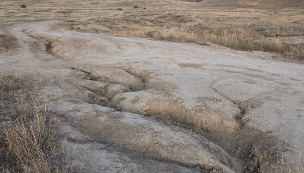 istock Dirt road impassable in the field blurred by rains 1287311227