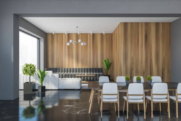 istock Grey and wooden dining room with sofa 1287311624