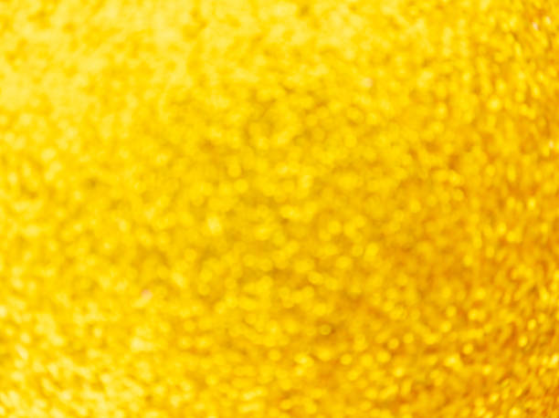istock Golden defocus lights background. Festive abstract swirling bokeh. 1287312519
