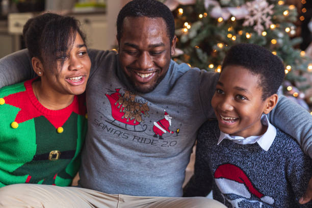 istock A cute family laughing on Christmas Day 1287314874