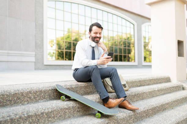 istock Professional worker sitting outside with his eco-friendly skateboard 1287317804