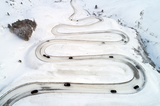 Aerial view of winding, completely snow covered Julier Pass in Switzerland.