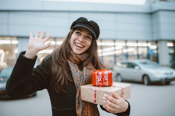 istock Beautiful woman greeting for Christmas. 1287326884