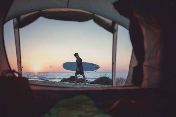 istock Male Surfer On The Beach. 1287326901