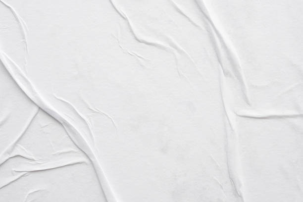 istock Blank white crumpled and creased paper poster texture background 1287326933