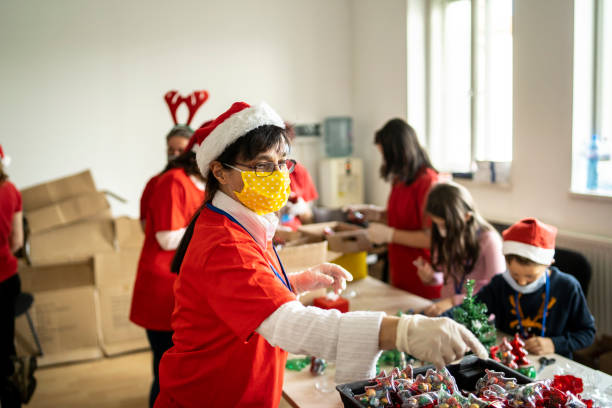 istock Volunteers packing presents for Christmas 1287326978