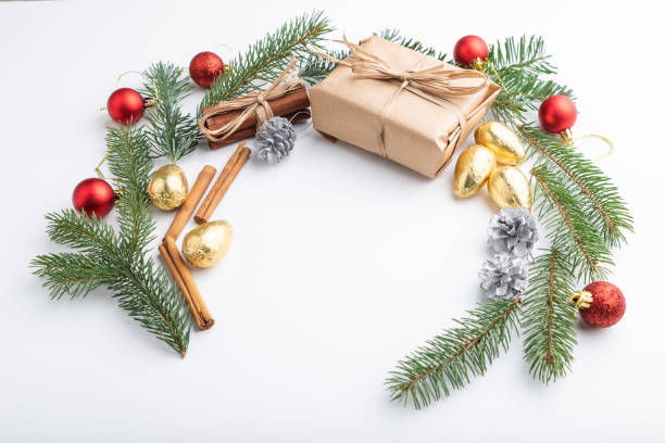 istock Christmas or New Year wreath composition. Decorations, balls, fir and spruce branches, on white background. Side view, copy space. 1287327669