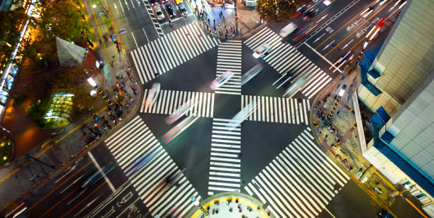 istock Traffic and people cross a busy intersection in Ginza 1287329840