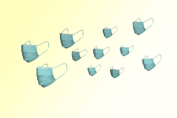 istock Multiple Flying Surgical Masks On A Yellow Background 1287337064