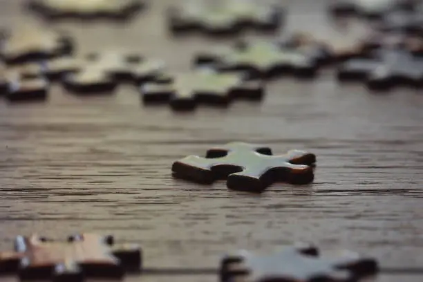 A single puzzle piece in foreground.