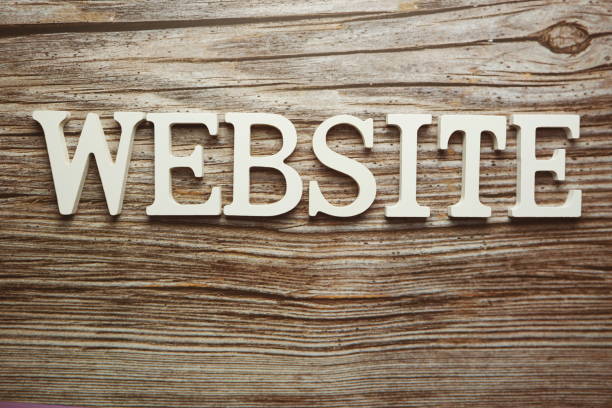 istock Website alphabet letter on wooden background 1287343239