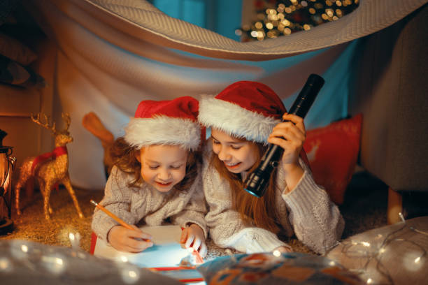 istock children writing letter to Santa 1287350411