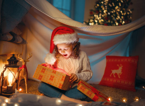 istock girl with Christmas gift 1287350412