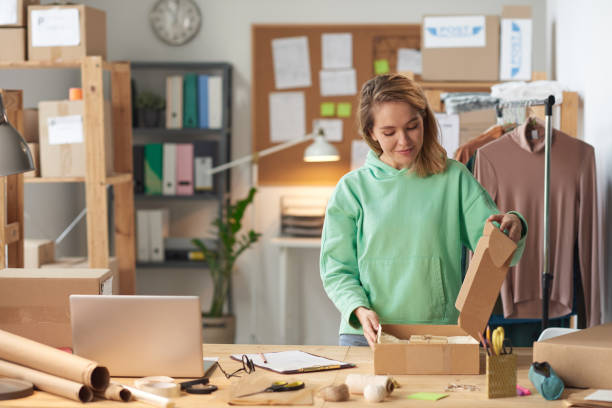 istock Woman opening the parcel 1287351296