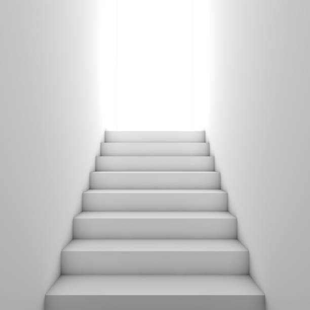 istock White stairway goes up to glowing door 1287351326