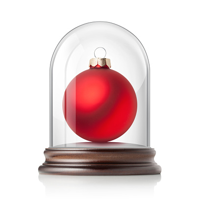 Red Christmas ball in glass bell jar isolated on white background.
