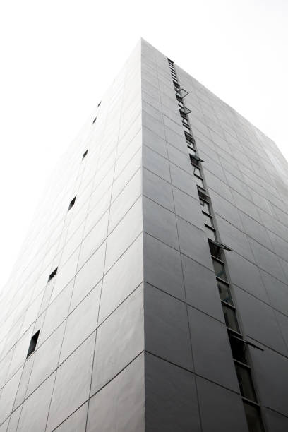 istock Perspective of Buildings on the white sky background and copy space 1287354670