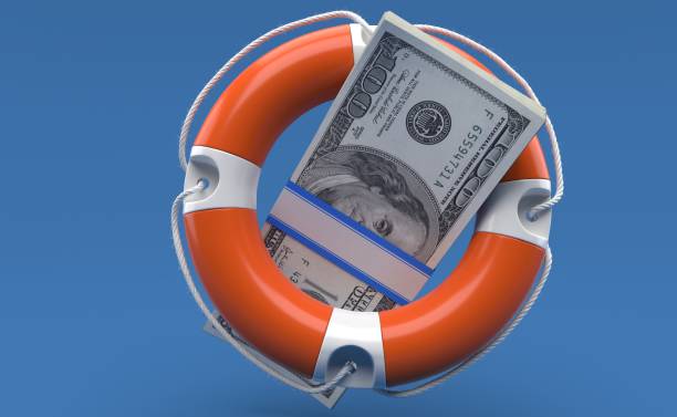 istock Dollar currency inside life buoy 1287355513