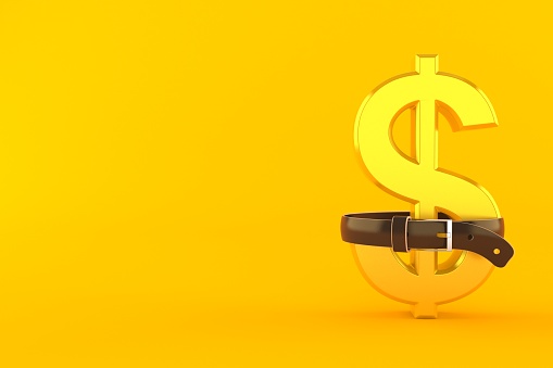 Dollar currency squeezed by belt isolated on orange background. 3d illustration