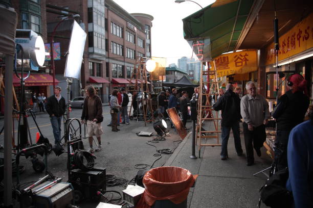Film crew setting up and filming movie at Vancouver Chinatown, in Vancouver, British Columbia, Canada stock photo