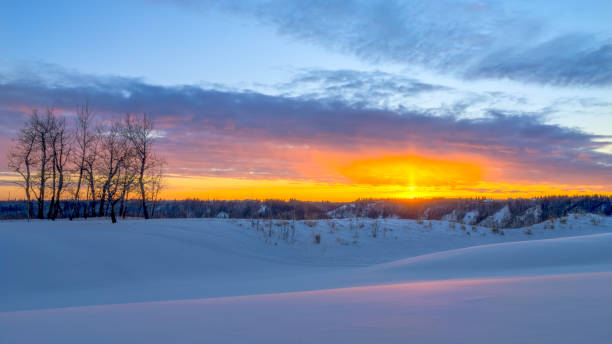 istock Sunset  in winter season with reflection on snow 1287356558