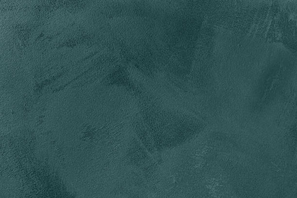 istock dark green colored low contrast Concrete textured background 1287360558